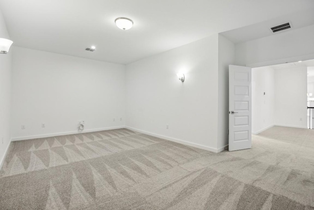 empty room with light colored carpet