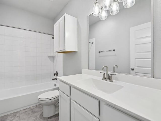 full bathroom with vanity, toilet, and washtub / shower combination