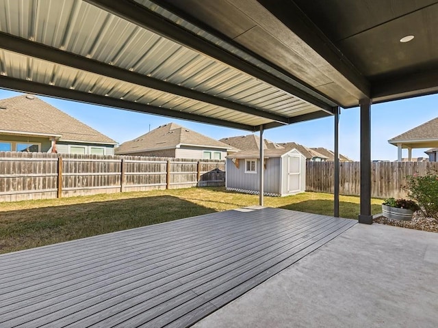 view of patio featuring a shed and a deck