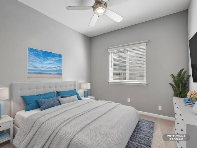 carpeted bedroom with ceiling fan