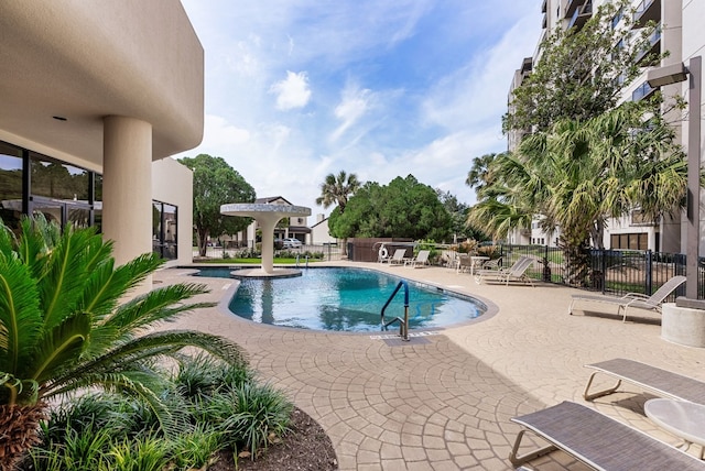 view of swimming pool with a patio area