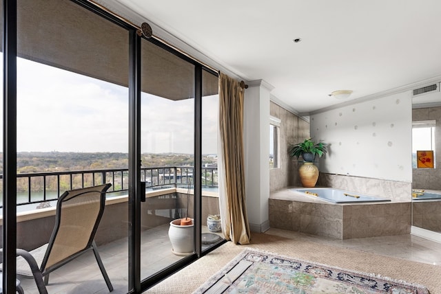 interior space featuring tile patterned floors, crown molding, and a healthy amount of sunlight