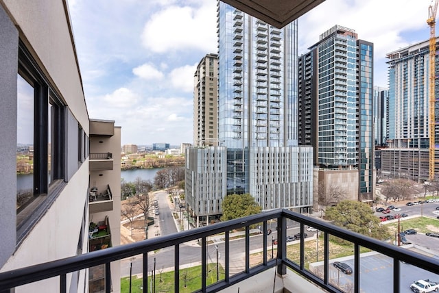 balcony featuring a water view