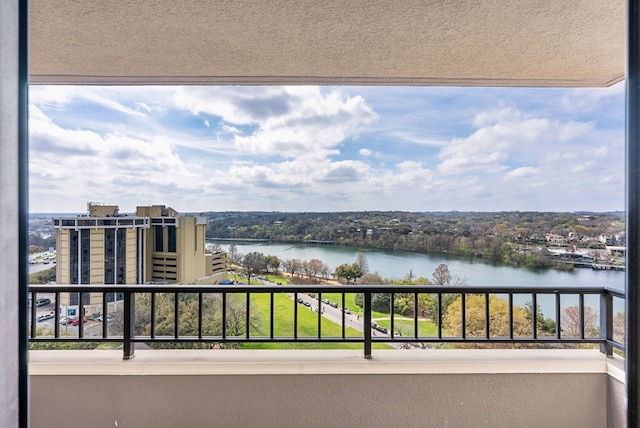 balcony featuring a water view