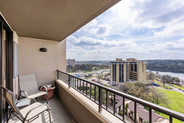 balcony featuring a water view