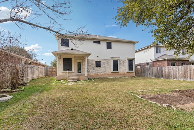 back of house with a yard