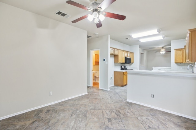 kitchen featuring tasteful backsplash, ceiling fan, stainless steel appliances, and sink