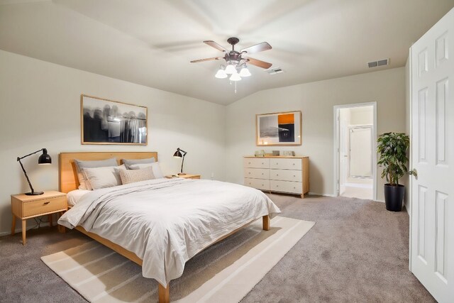 carpeted bedroom with lofted ceiling, ensuite bathroom, and ceiling fan