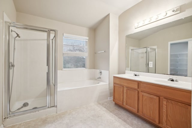 bathroom featuring vanity and separate shower and tub