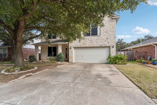 view of front of home featuring a front yard and a garage