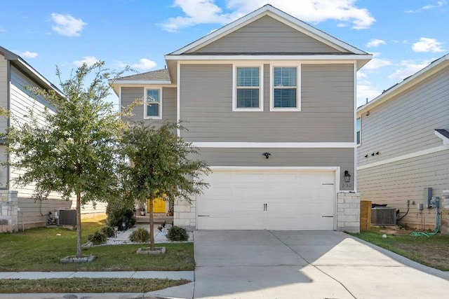 232 Syrah Ct, Leander, TX 78641 - view of front of property with an attached garage, central AC, driveway, and a front lawn