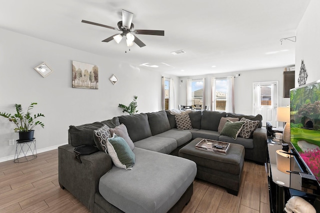 living room featuring ceiling fan