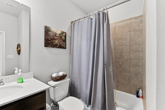 full bathroom featuring shower / bath combo with shower curtain, vanity, and toilet