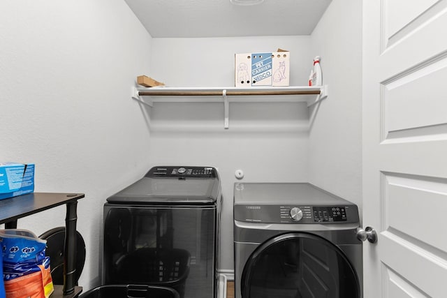 washroom featuring washer and dryer