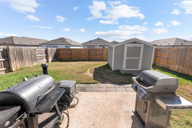 view of patio with a grill and a shed