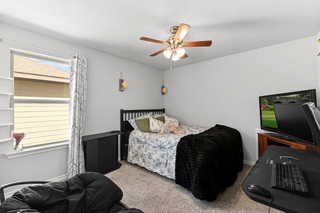 bedroom featuring light carpet and ceiling fan