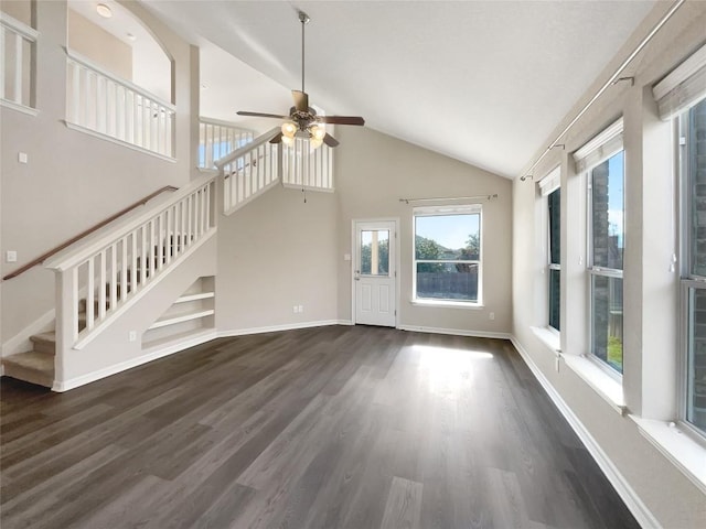 unfurnished living room featuring dark hardwood / wood-style floors, high vaulted ceiling, and ceiling fan