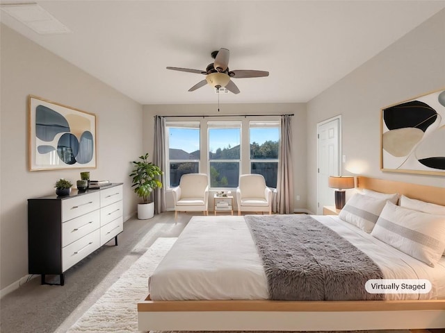 carpeted bedroom featuring ceiling fan