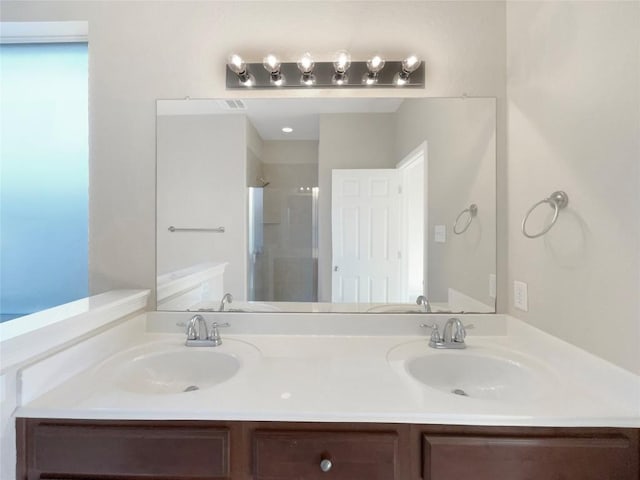 bathroom featuring vanity and walk in shower