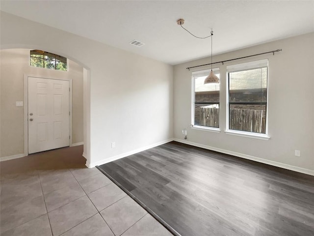 unfurnished dining area with tile patterned floors