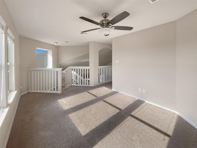 carpeted empty room with ceiling fan