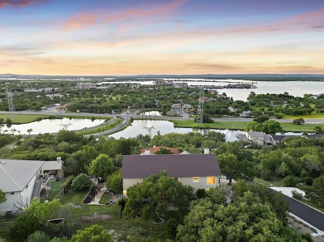 aerial view at dusk with a water view