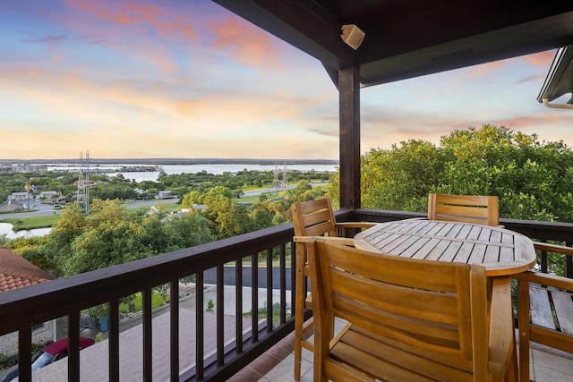 balcony at dusk with a water view