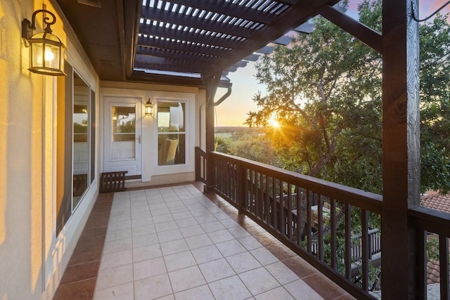 balcony at dusk with a pergola