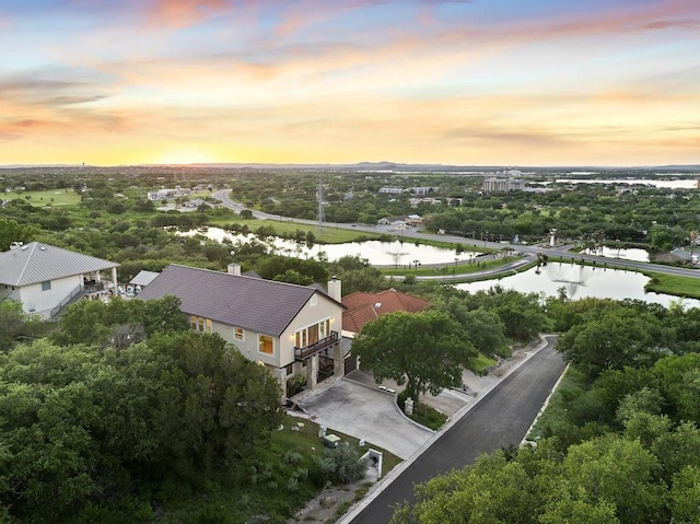 aerial view at dusk with a water view