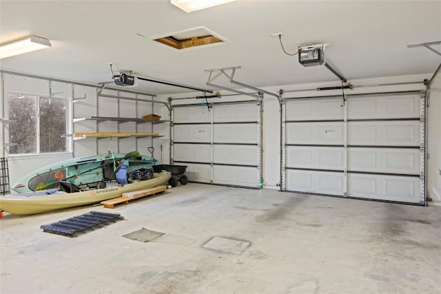 garage featuring a garage door opener