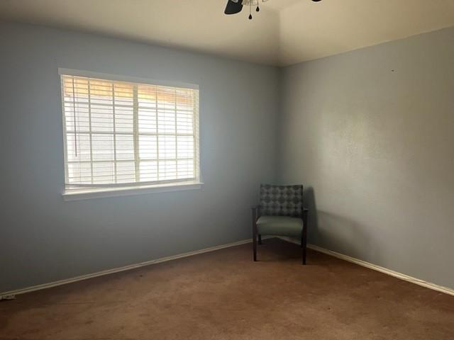 unfurnished room featuring carpet flooring, ceiling fan, and vaulted ceiling