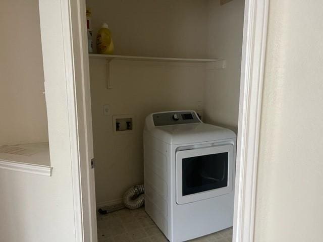 clothes washing area with washer / clothes dryer