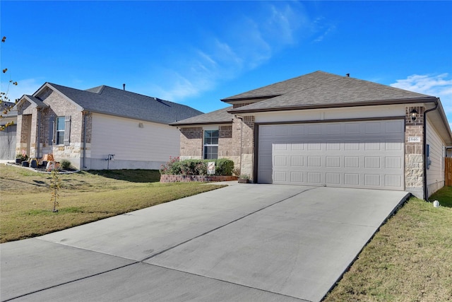 ranch-style house featuring a garage and a front yard