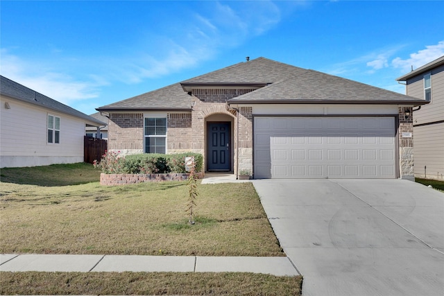 view of front of house with a front lawn and a garage