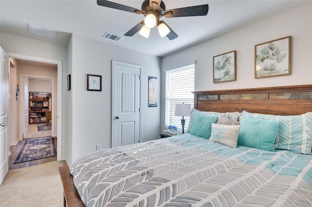 bedroom featuring ceiling fan, a closet, and carpet flooring