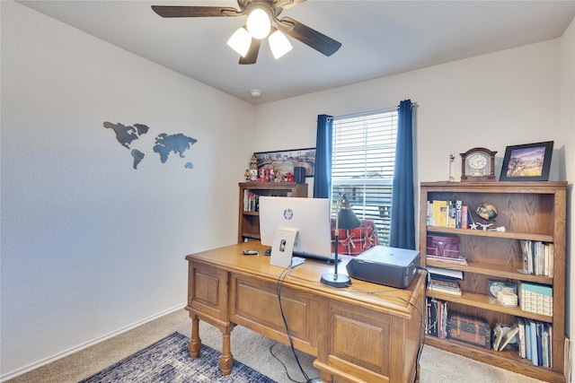 home office with ceiling fan and carpet flooring