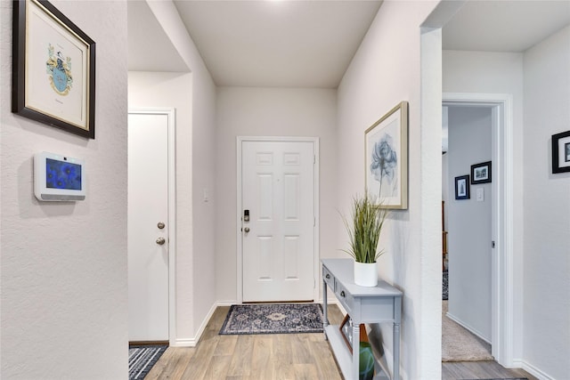 foyer with light wood-type flooring