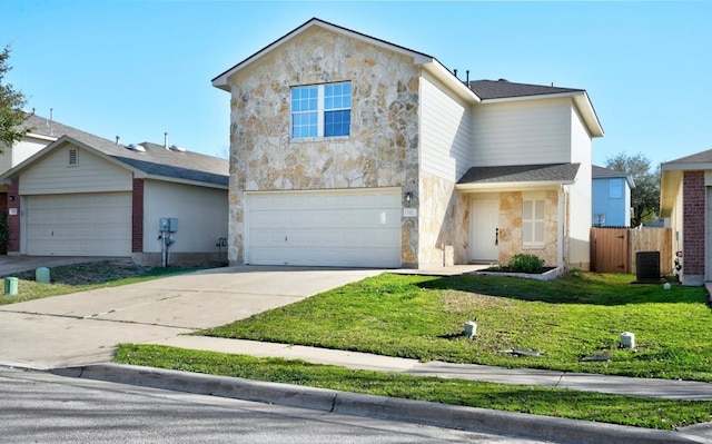 view of front property with central AC, a front yard, and a garage