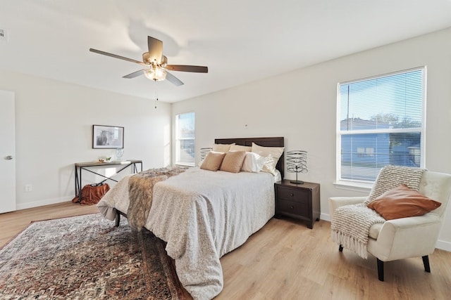 bedroom featuring light hardwood / wood-style floors and ceiling fan