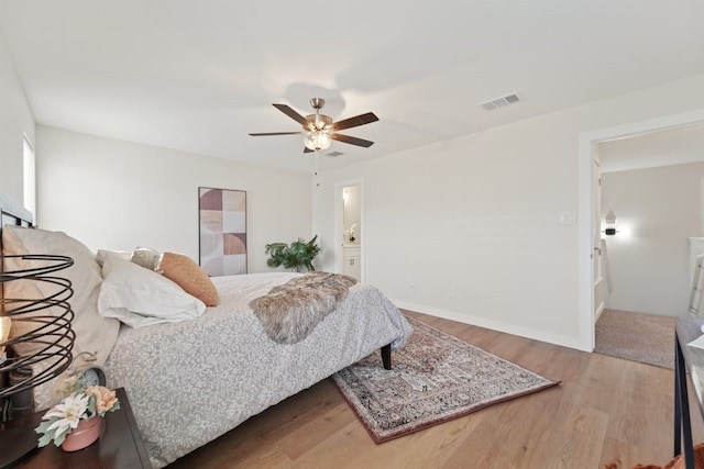 bedroom with ceiling fan and hardwood / wood-style flooring