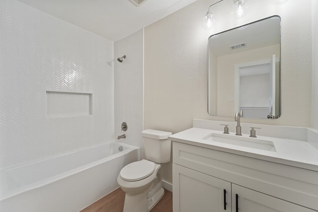 full bathroom featuring vanity, toilet, wood-type flooring, and bathing tub / shower combination