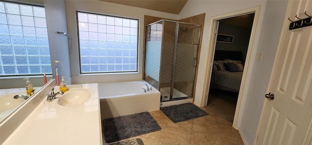 bathroom with shower with separate bathtub, tile patterned floors, a wealth of natural light, and sink