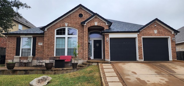 view of front of property with a garage