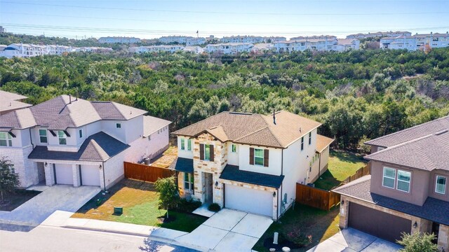 birds eye view of property with a residential view