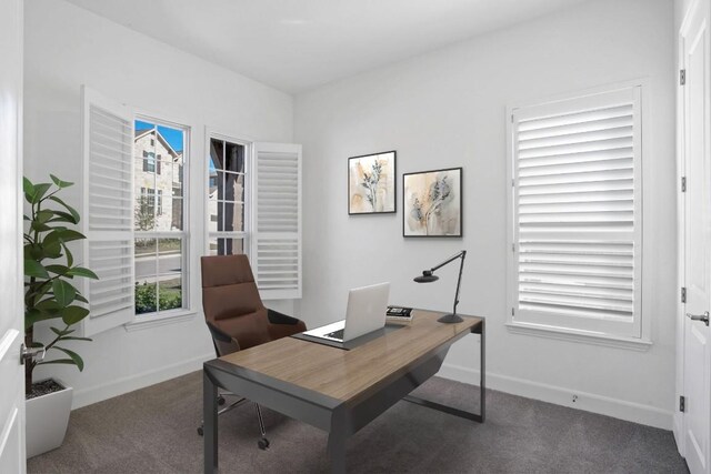 home office featuring carpet and baseboards