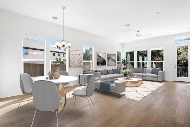 interior space with wood finished floors, visible vents, and baseboards