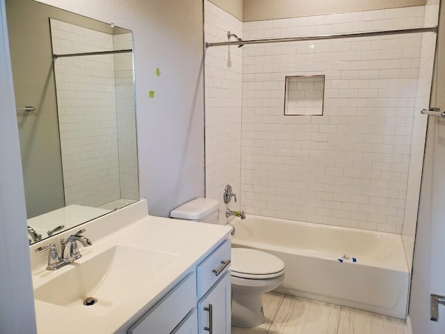 full bathroom featuring vanity, toilet, and tiled shower / bath