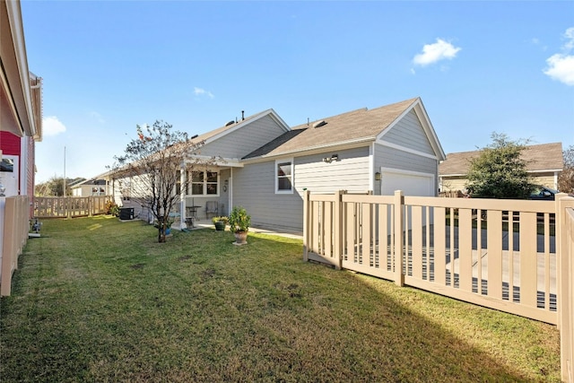 rear view of property featuring a lawn