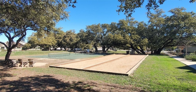 view of property's community featuring a yard