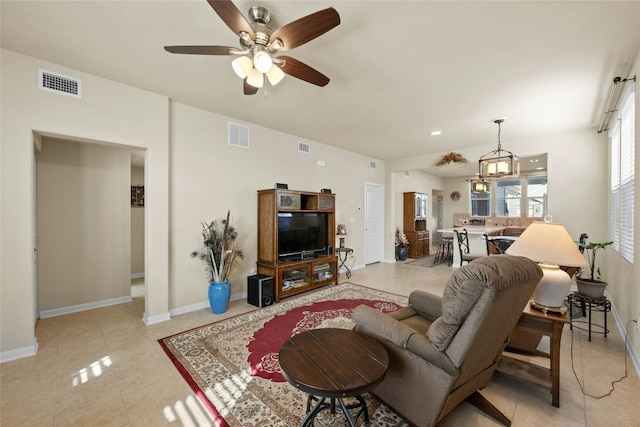 living room with ceiling fan and light tile patterned flooring